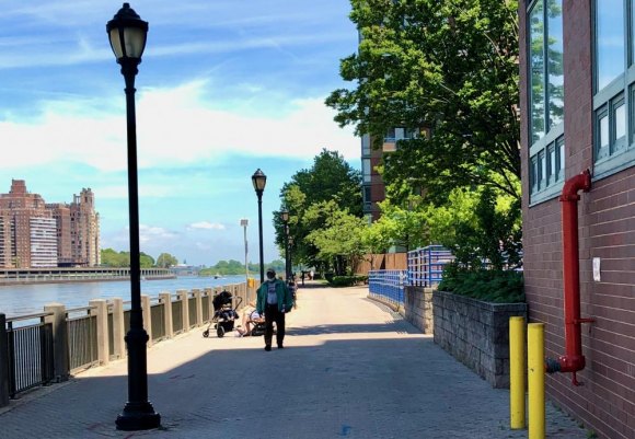 Hey, RIOC! Let's do something about the bikes while there's time. If our promenades are to remain safe refuges for folks out for walks and relaxing on benches, where can bicycles safely squeeze in in volume? A radically different space emerges, and RIOC must address it.